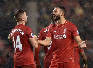 Jordan Henderson of Liverpool shakes hands with Steven Caulker of Liverpool at the end of the Barclays Premier League match between Liverpool and Arsenal at Anfield on January 13, 2016 in Liverpool, England.