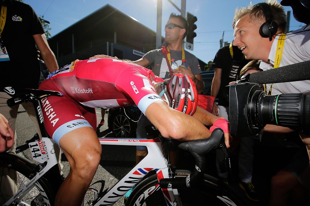 Alexander Kristoff slumps over his bike in frustration after losing stage 16 of the Tour de France