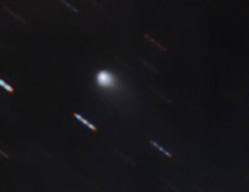 In this Gemini Observatory image, the possible interstellar comet can be seen as it streaks across the night sky.