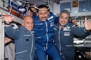 American space tourist Dennis Tito (right) with Russian cosmonauts.
