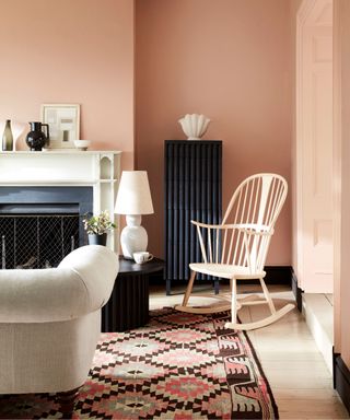living room with peach paint and beige furniture
