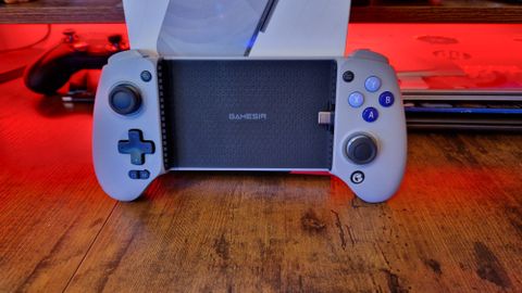 GameSir G8 Galileo review image of the controller standing up against its box with red RGB lighting behind it