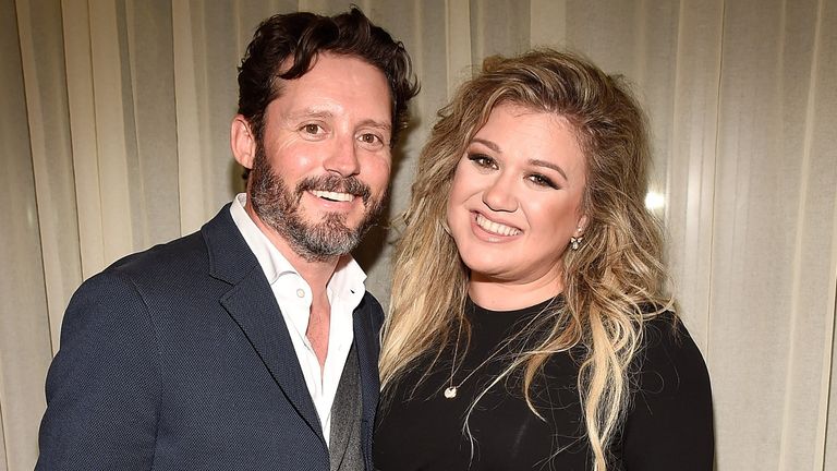 Brandon Blackstock and Kelly Clarkson backstage after she performed songs from her new album "The Meaning of Life" at The Rainbow Room on September 6, 2017 in New York City.