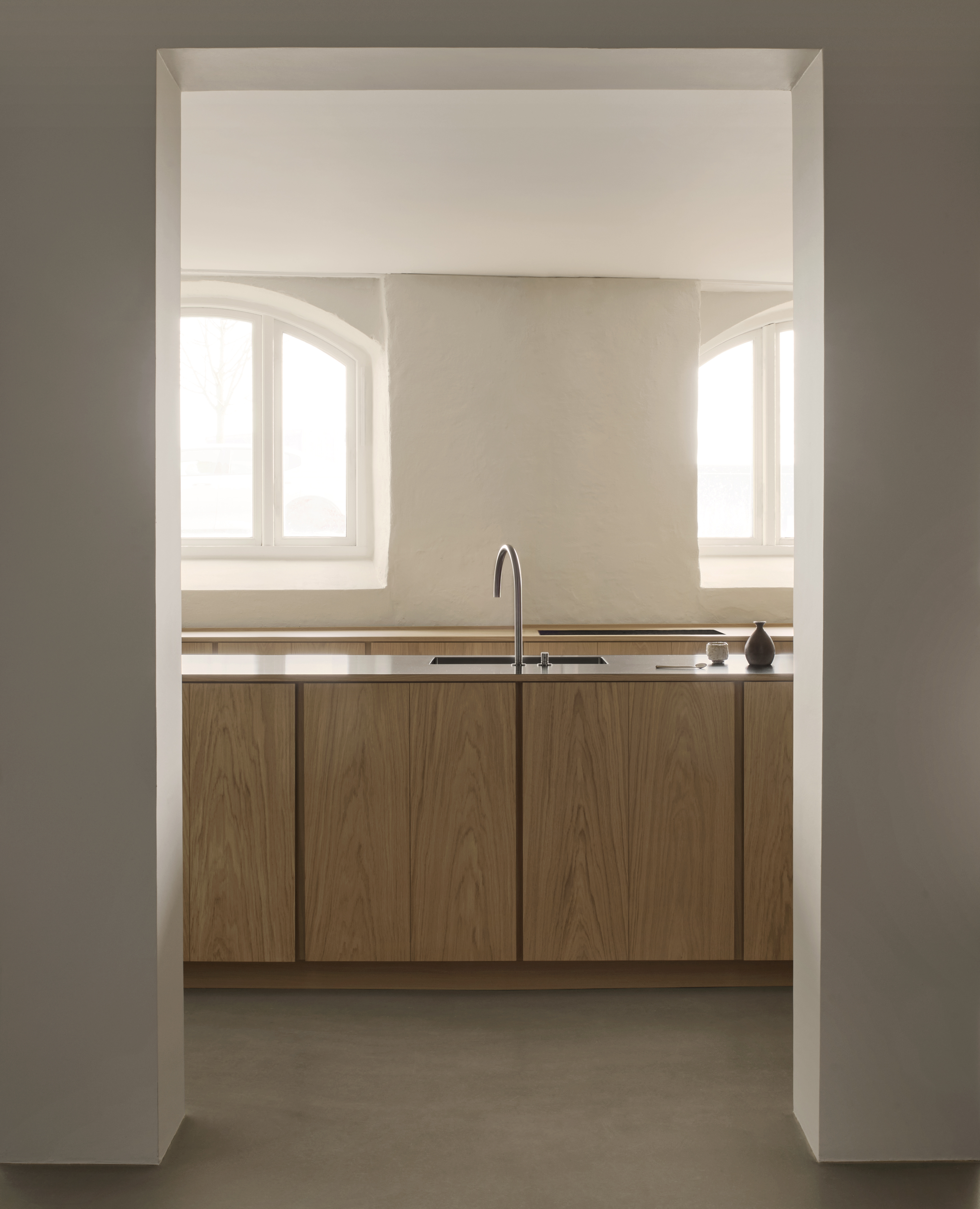 A small kitchen with a solid wood island
