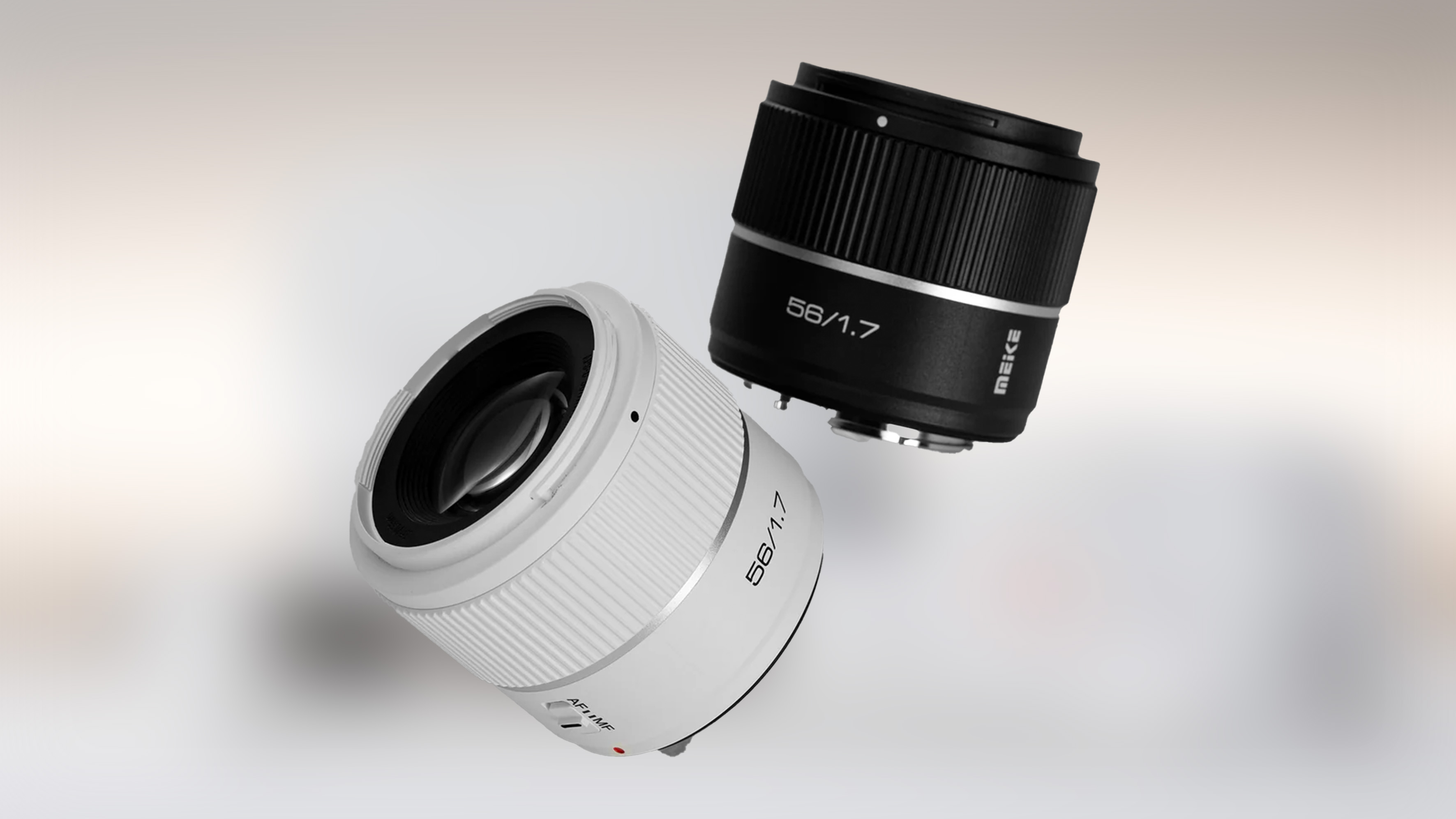 A pair of camera lenses: one black, one white.