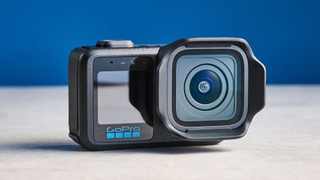 The GoPro Mission 1 Pro on a stone surface against a blue background