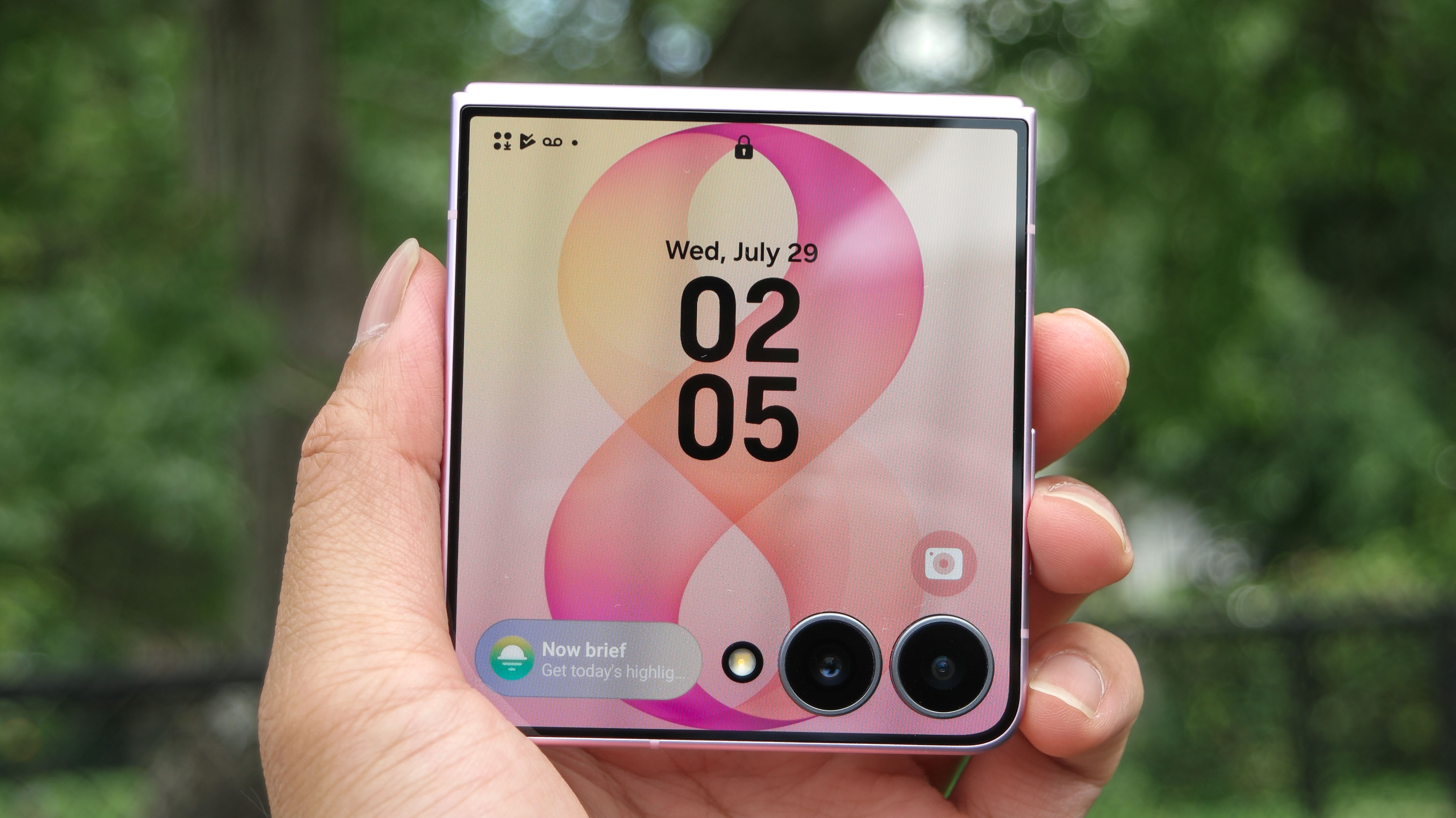 Samsung Galaxy Z Flip 8 held in hand with FlexWindow on.