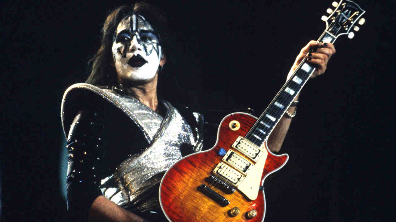 Ace Frehley performing onstage with Kiss in 1996
