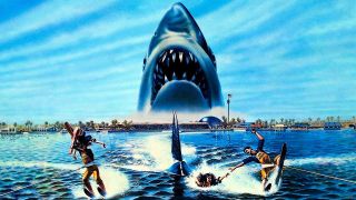This is a movie poster for Jaws 3-D. It's a drawing of people water-skiing and in the sky looms the giant head of a great white shark.