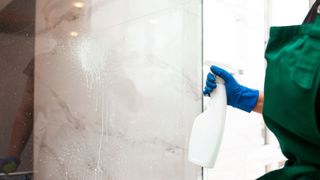 Best cleaning hacks - Spray white vinegar on shower doors to remove hard water marks