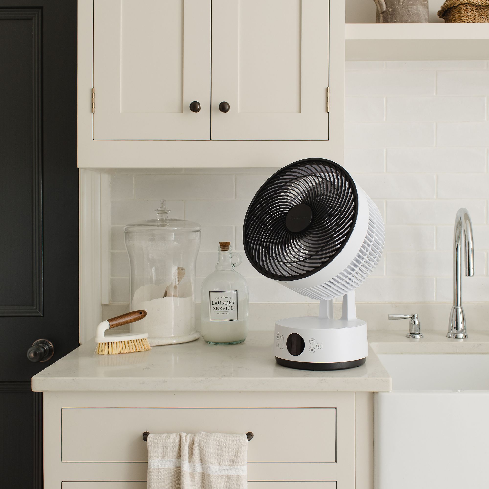 Meaco Sefte Pro table top air circulator on a kitchen side next to a butler sink
