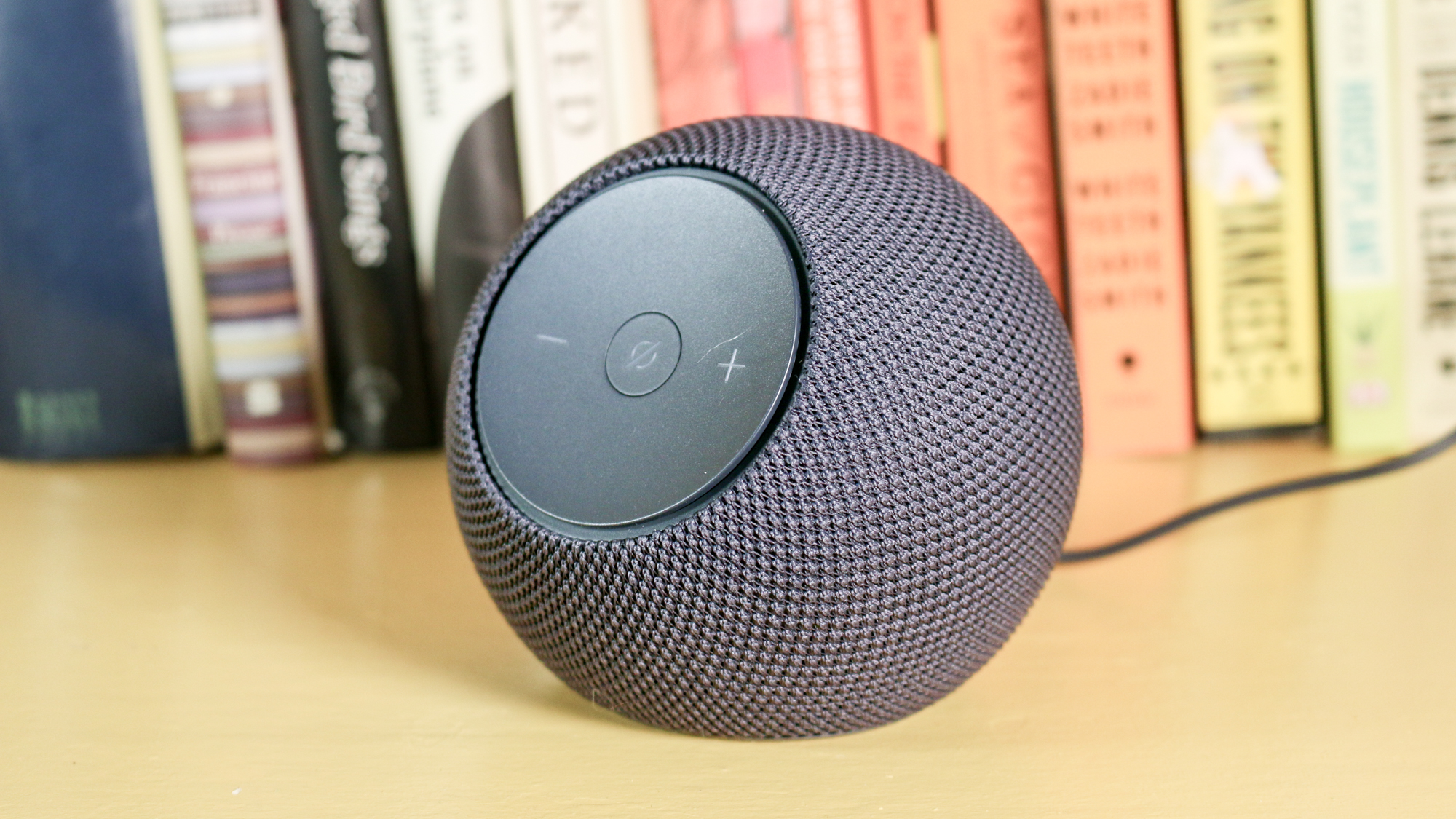 Echo Dot Max on a book shelf