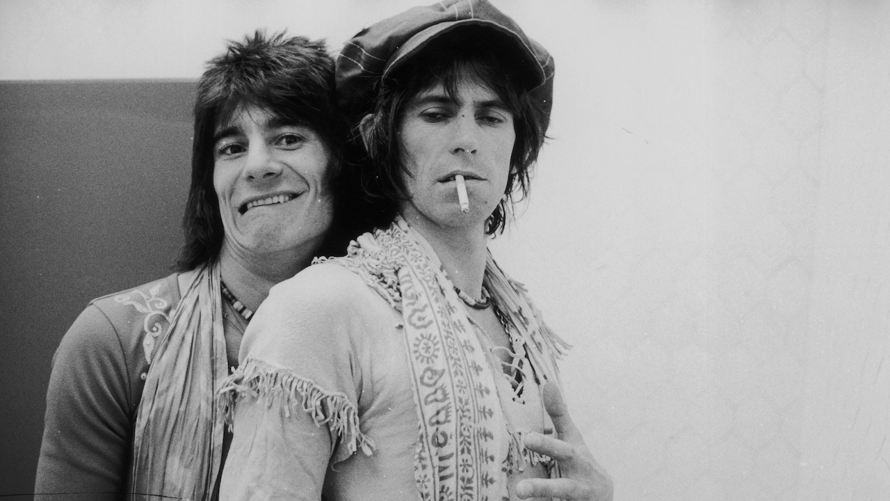 Jovial guitarist Ron Wood (left) embraces his elegantly wasted colleague Keith Richards backstage during the Rolling Stones' 1975 Tour of the Americas.