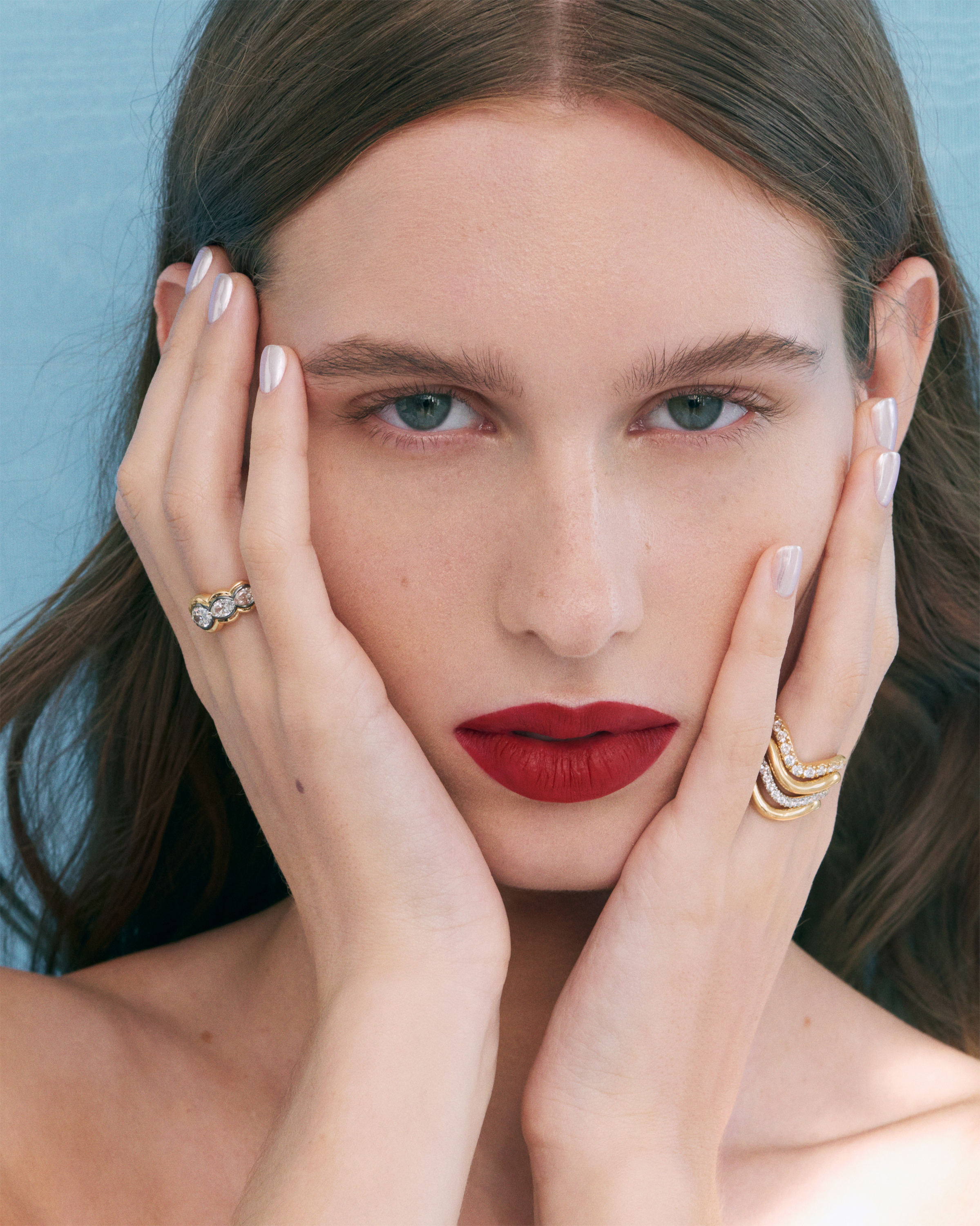 a model wearing an engagement ring from jessie thomas