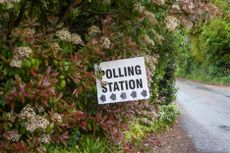 A Polling Station sign hanging in a shrub in South Stoke, Oxfordshire