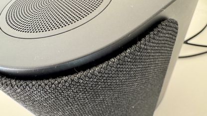 Bose Lifestyle Ultra speaker on a white table 