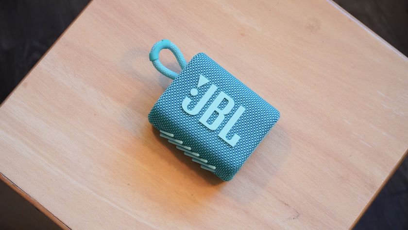 The JBL Go 3 speaker on a drum. 