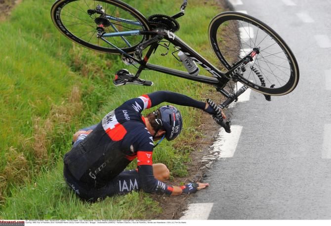 Martin Elmiger (IAM Cyling) spectacularly rolls out of a crash