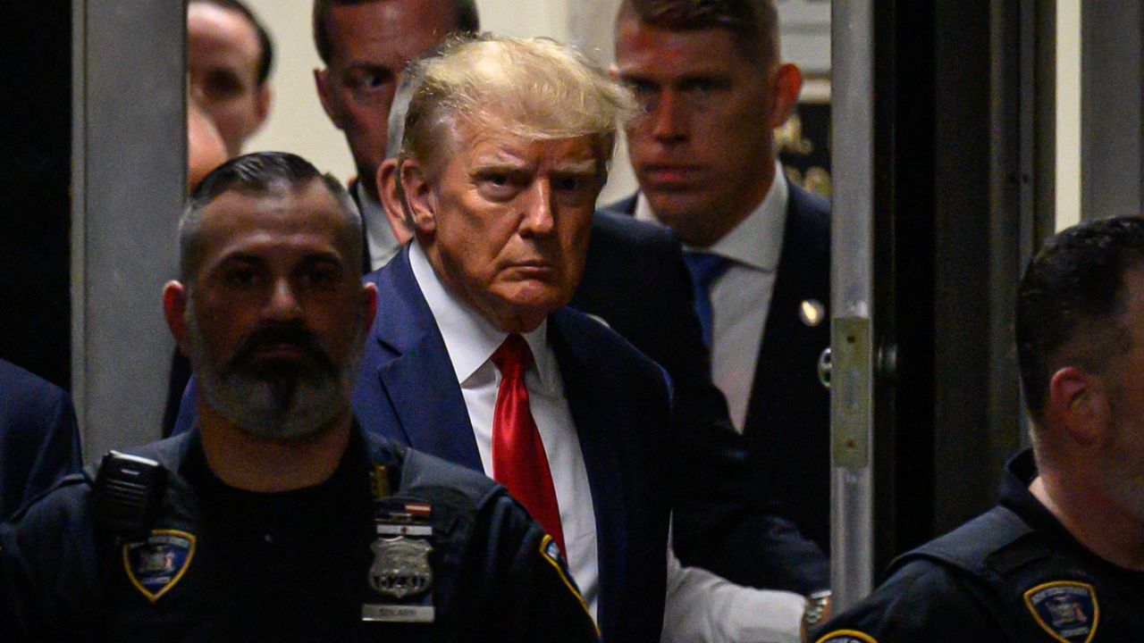 Former US President Donald Trump makes his way inside the Manhattan Criminal Courthouse in New York on April 4, 2023. - Donald Trump will make an unprecedented appearance before a New York judge on April 4, 2023 to answer criminal charges that threaten to throw the 2024 White House race into turmoil