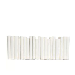 row of white covered decorative books