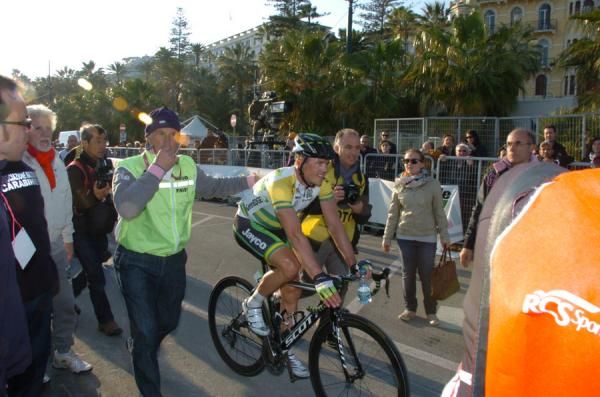 Still in disbelief, Gerrans is escorted to the podium.