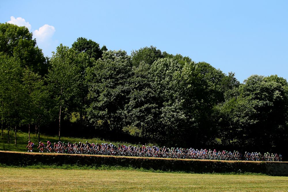 The peloton rolls through better weather near the start of stage 12.
