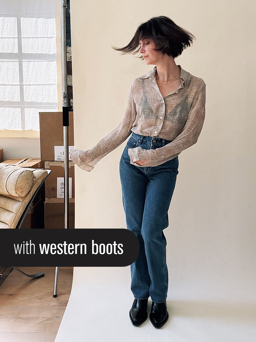 Jane Herman in slim-fitting jeans and a button-down