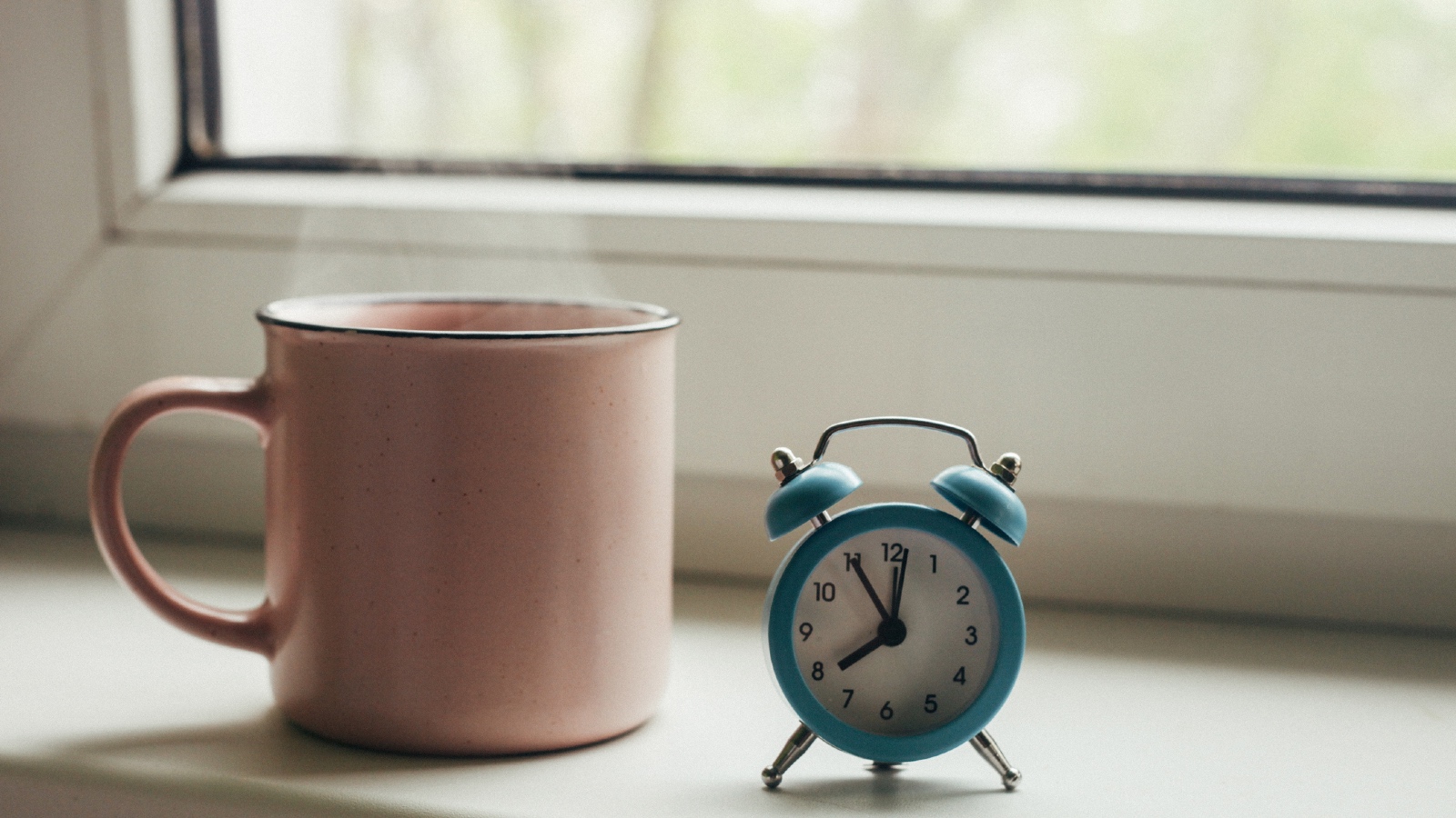 Chamomile tea and alarm clock