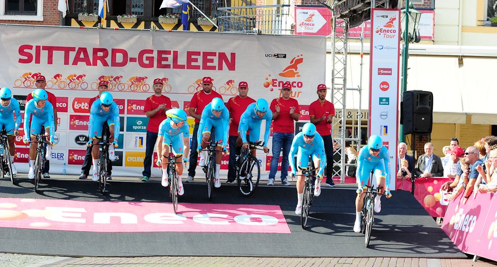 Astana riders roll off the start ramp for the stage 5 time trial at Eneco Tour