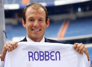 Arjen Robben with a Real Madrid shirt at the Santiago Bernabeu after signing for the Spanish club in 2004.