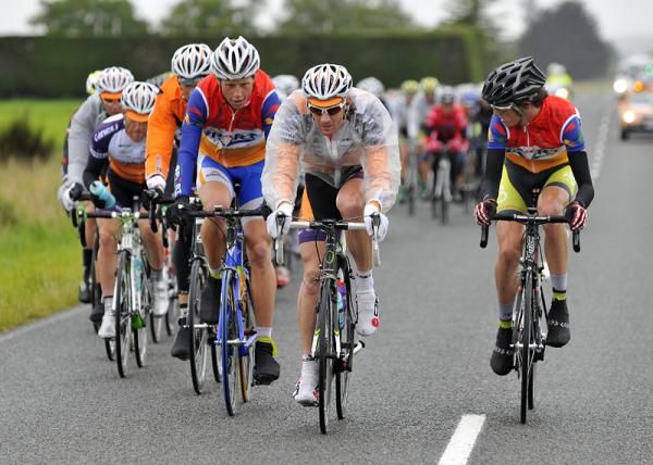 Two riders from Radio Sport assist Share the Road with keeping the break in check