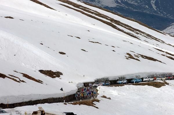 Racers on narrow roads through the mountains.