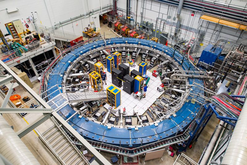 A top view of the equipment used in the g-2 experiment at Fermilab. The experiment uses a muon beamline, electronic racks and superconducting magnetic storage ring cooled to minus 450 degrees Fahrenheit (minus 267 degrees Celsius) to study the wobble of muons.