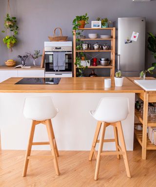 A kitchen island in a lived in kitchen