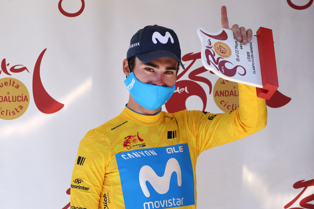 ZAHARA DE LA SIERRA SPAIN MAY 18 Gonzalo Serrano of Spain and Movistar Team yellow leader jersey celebrates at podium during the 67th Vuelta A Andalucia Ruta Del Sol 2021 Stage 1 a 1521km stage from Mijas to Zahara de la Sierra 441m Mask Covid safety measures Trophy VCANDALUCIA on May 18 2021 in Zahara de la Sierra Spain Photo by Gonzalo Arroyo MorenoGetty Images