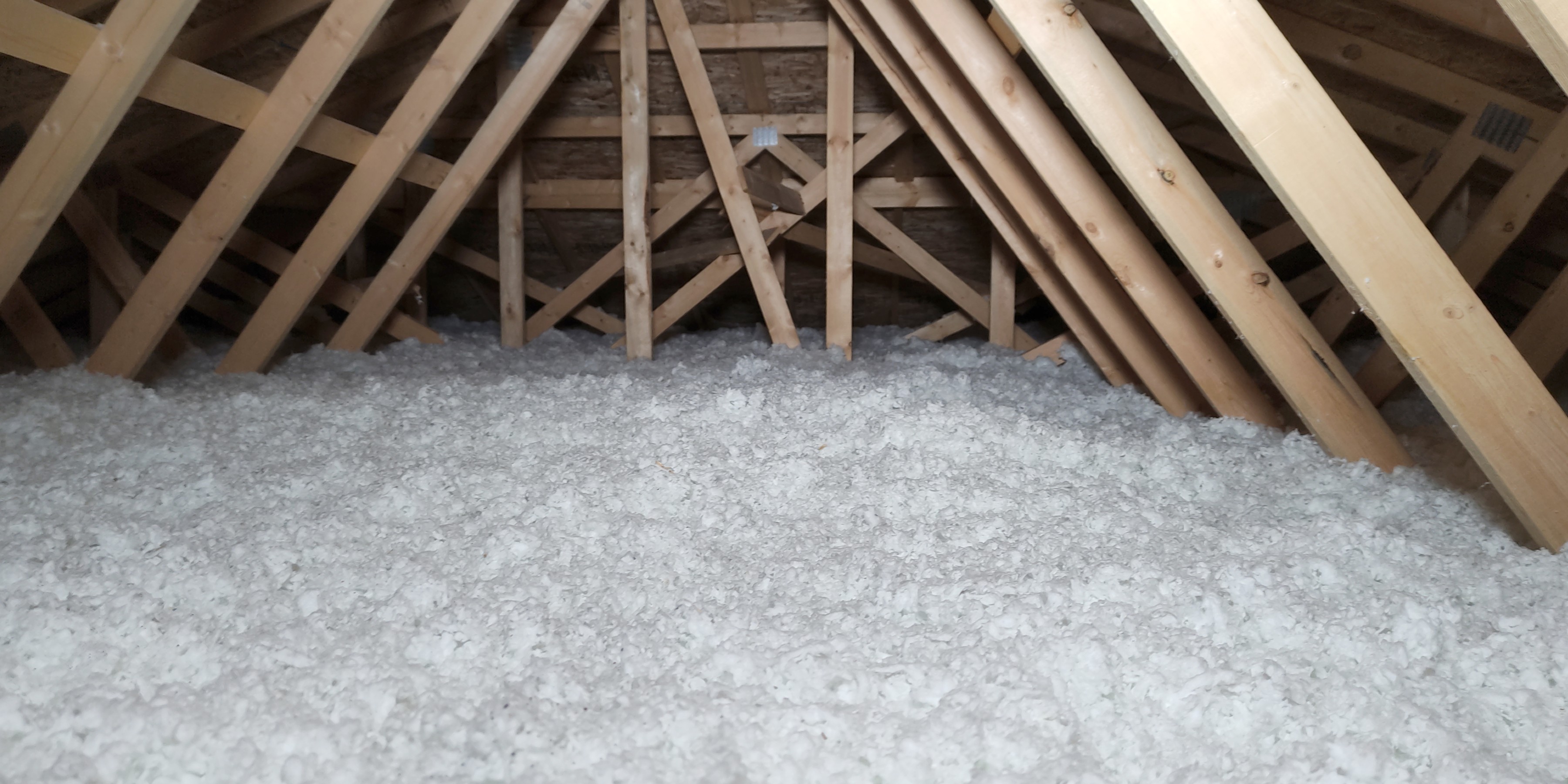Blown cellulose loose fill insulation in a loft space