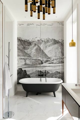 monochrome modern bathroom with mural and freestanding bath