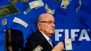 ZURICH, SWITZERLAND - JULY 20: Comedian Simon Brodkin (not pictured) throws dollar bills at FIFA President Joseph S. Blatter during a press conference at the Extraordinary FIFA Executive Committee Meeting at the FIFA headquarters on July 20, 2015 in Zurich, Switzerland. (Photo by Philipp Schmidli/Getty Images)