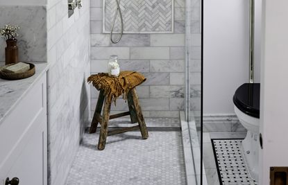 a bathroom floor with a mosaic tile