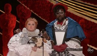Oscars 2019 Melissa McCarthy and Brian Tyree Henry dressed in weird costumes presenting at the Oscar