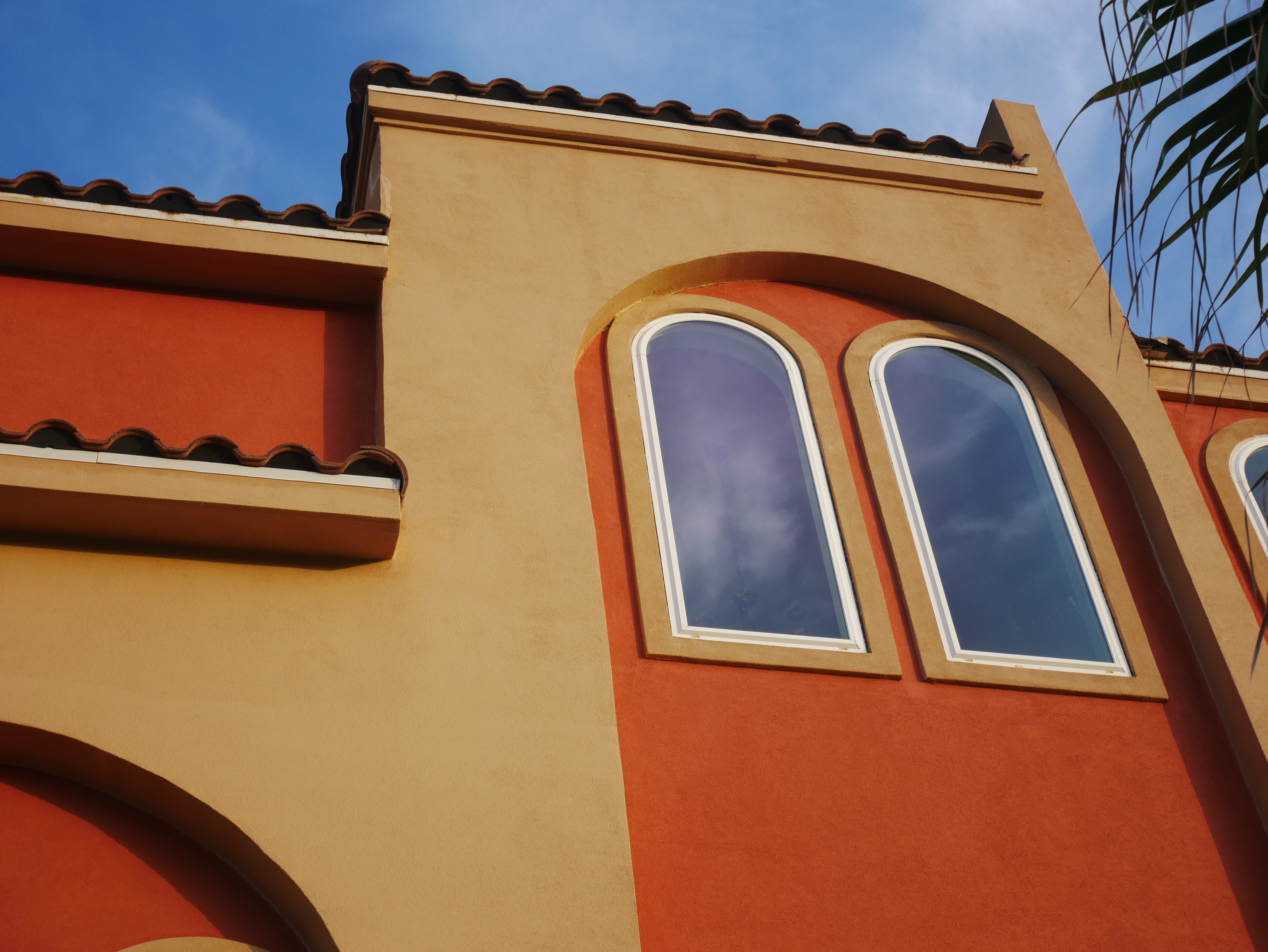An orange building against a blue sky