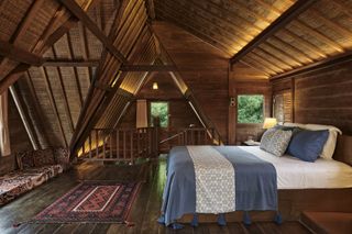 Bedroom with dark wooden floor boards