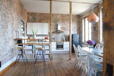 Industrial style kitchen in an exposed brick space from Cult Furniture