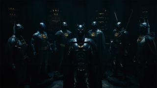 A screenshot of the seven Batsuits seen in The Flash movie