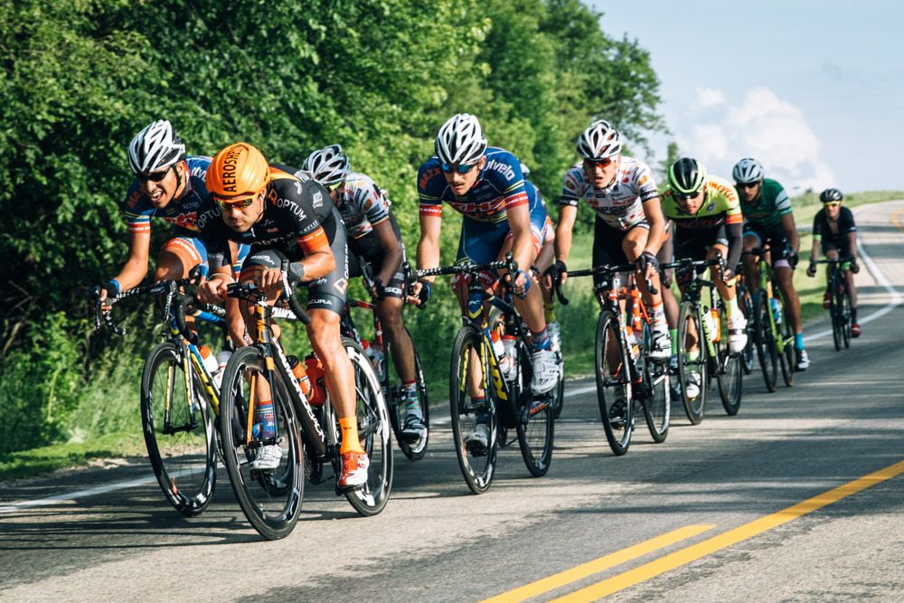 The breakaway cruises in the evening light down one of the courses gentle downhills