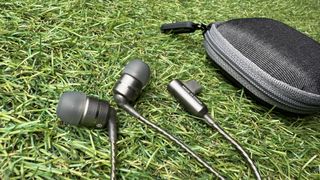 SoundMagic E80D wired USB-C hedaphones on grass and mosaic