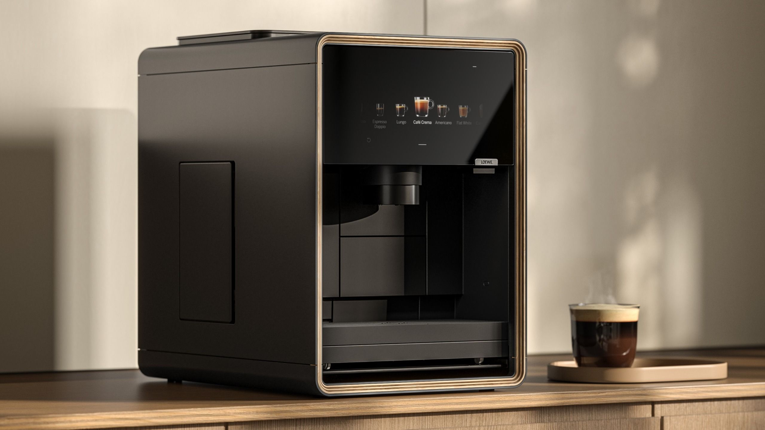 Loewe aura.matic espresso machine on table