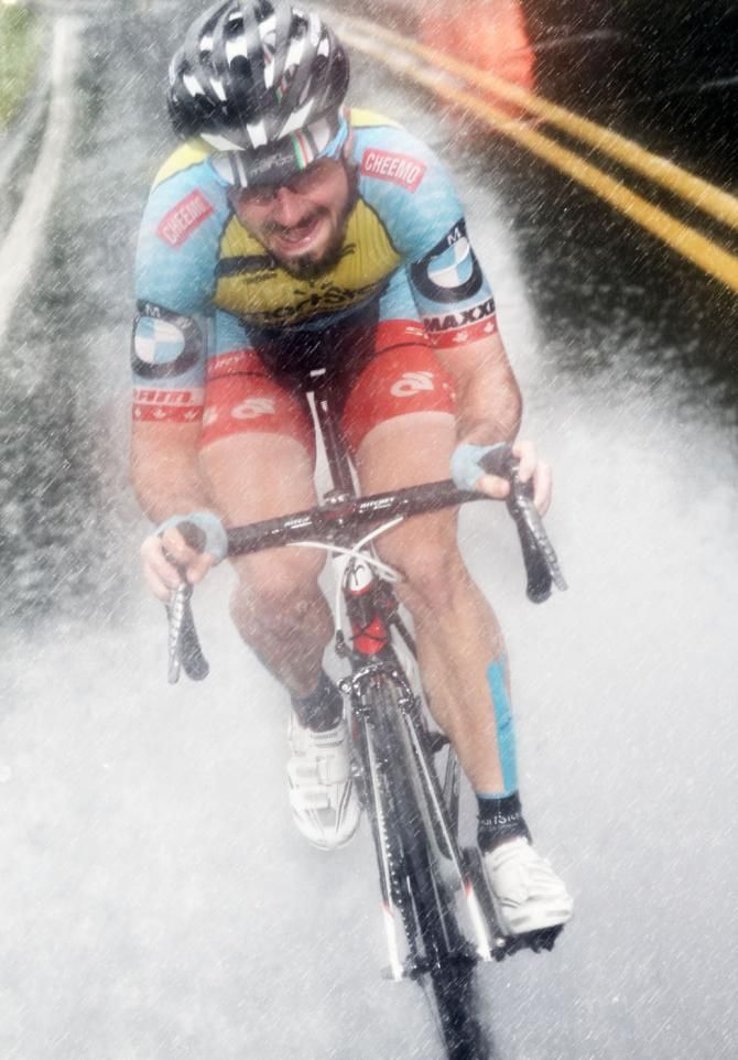 The weathermen called for only 40% chance for rain for today. Zachary Bell (Team SmartStop Pro Cycling) does his best to ride between the raindrops