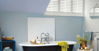 bathroom with pale blue painted walls and ceilings to suggest a best color for ceilings to make a room feel bigger