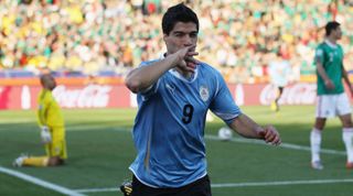 RUSTENBURG, SOUTH AFRICA - JUNE 22: Luis Suarez of Uruguay celebrates scoring the opening goal during the 2010 FIFA World Cup South Africa Group A match between Mexico and Uruguay at the Royal Bafokeng Stadium on June 22, 2010 in Rustenburg, South Africa. (Photo by Streeter Lecka/Getty Images)